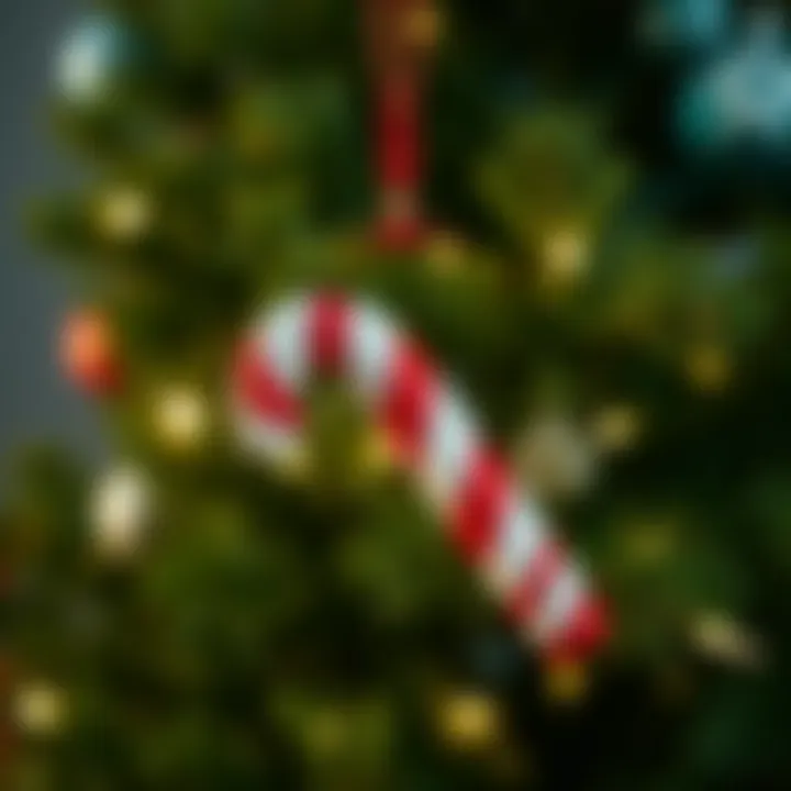 Large red and white candy cane ornament hanging on a lush green Christmas tree with twinkling fairy lights